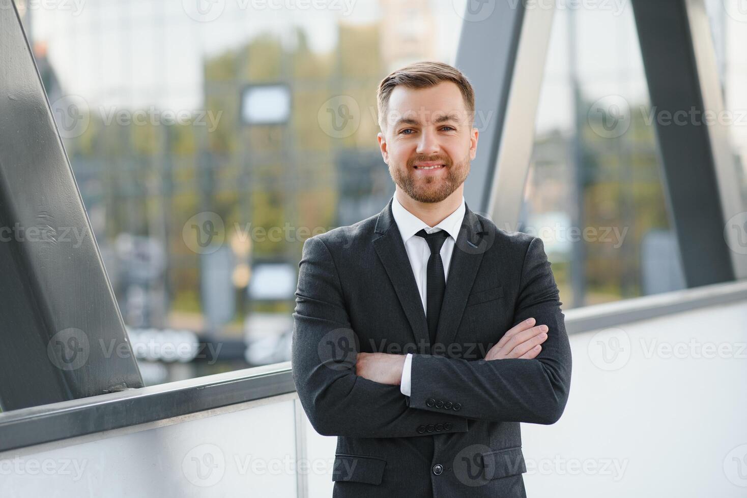Portrait of a smiling businessman in a modern business environment photo
