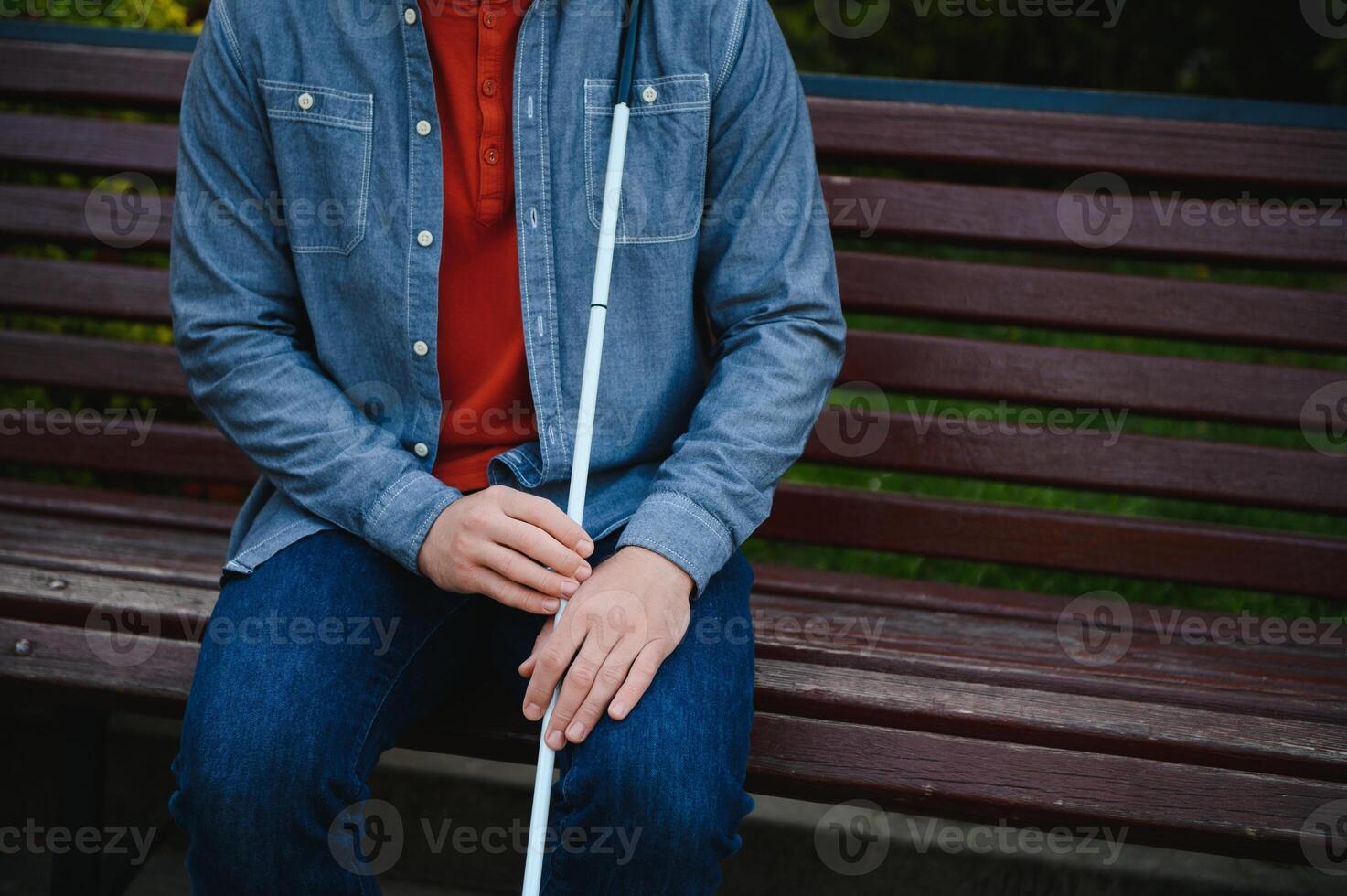 Blind man. People with disability, handicapped person and everyday life. Visually impaired man with walking stick. photo