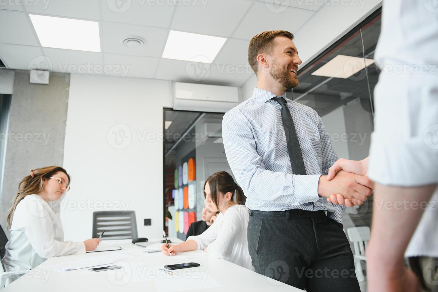 A group of business people partners during a set team meeting in the modern office. Teamwork concept photo