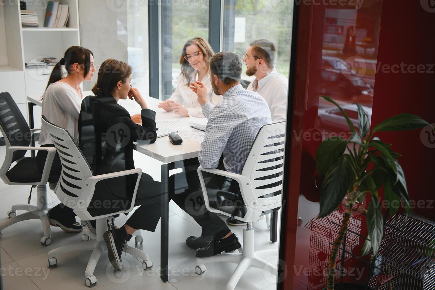 Corporate business team and manager in a meeting room at modern office with panoramic windows. Business concept photo