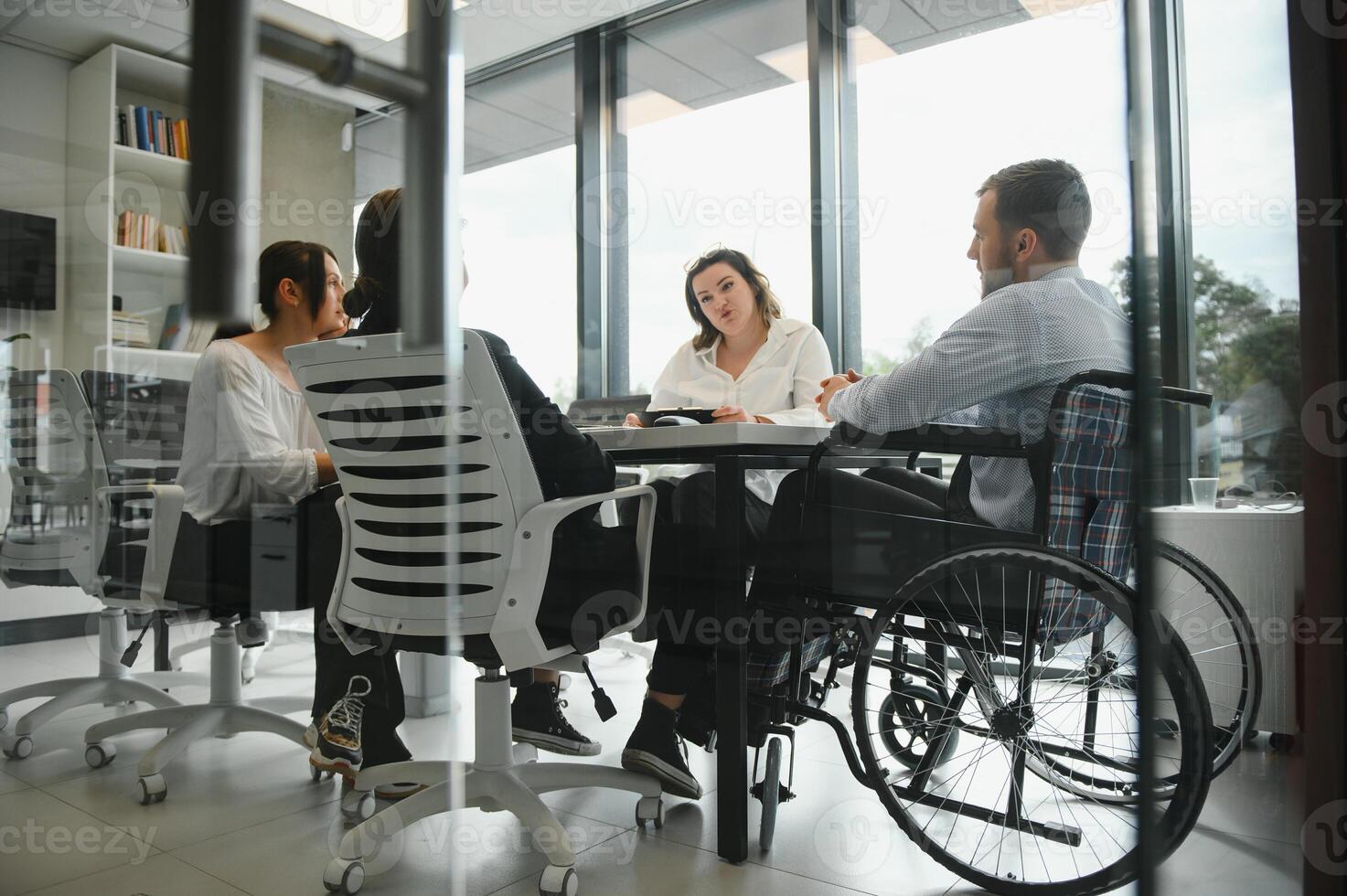 Corporate business team and manager in a meeting room at modern office with panoramic windows. Business concept photo