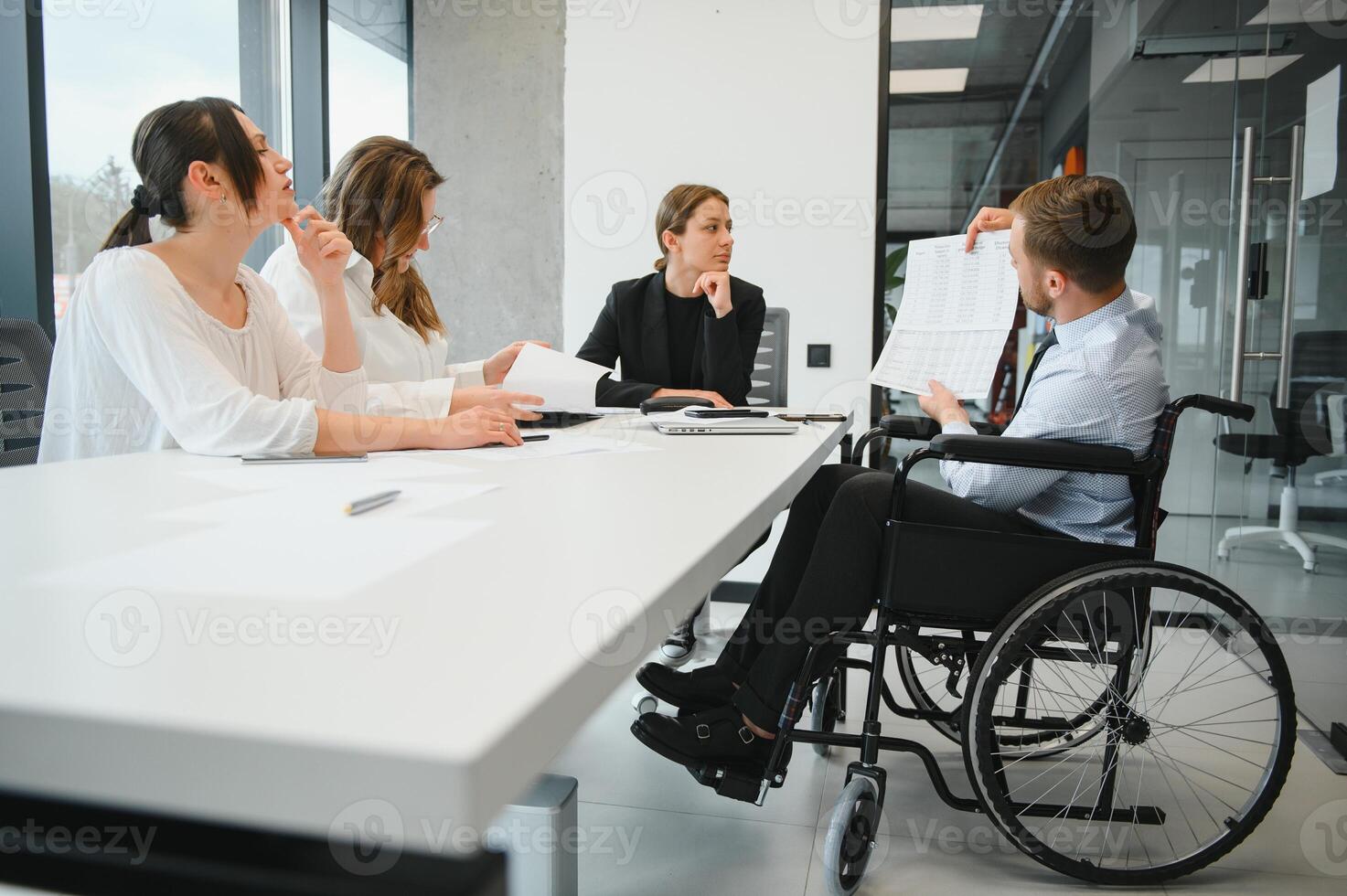 Confident and successful team. Group of people are working together in office. Blurred background photo