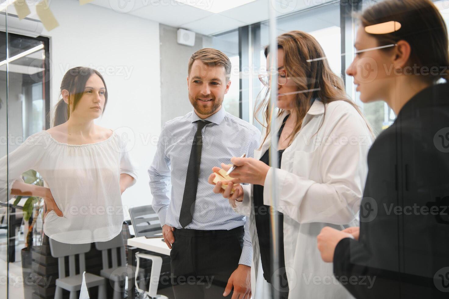 Corporate business team and manager in a meeting room at modern office with panoramic windows. Business concept photo