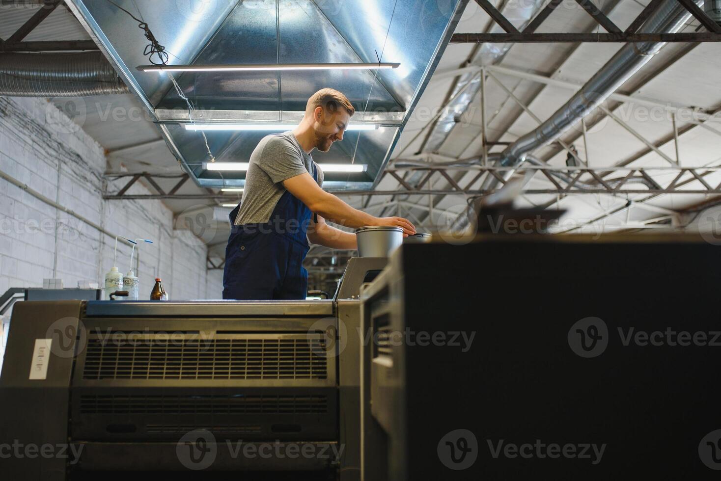 Factory worker. Man working on the production line. photo