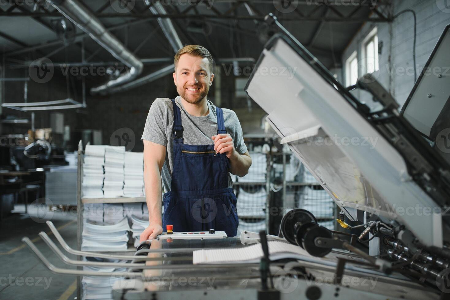worker in factory on the machine photo