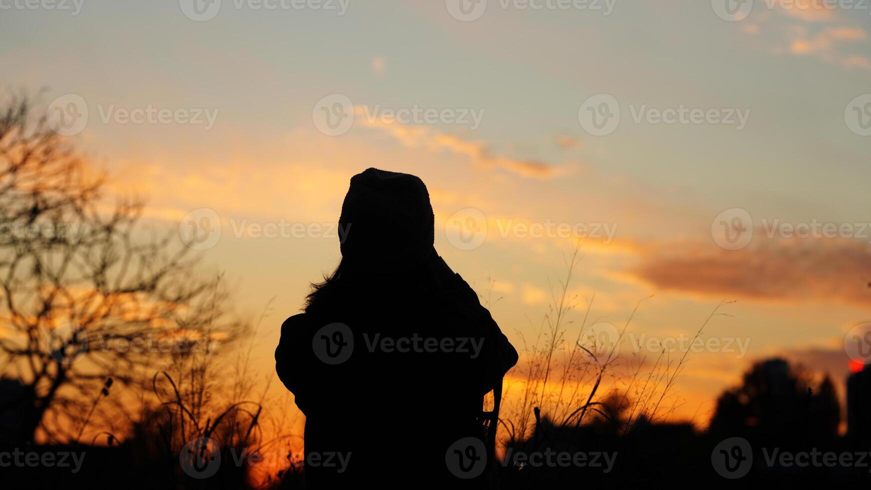 The sunset view with the silhouette and yellow sky in the city photo