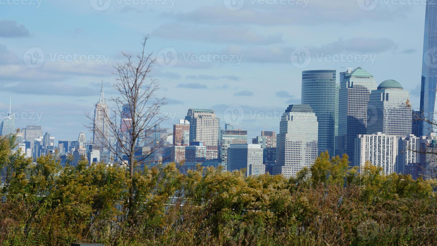The beautiful New York city view with the colorful autumn trees and buildings as background in autumn photo