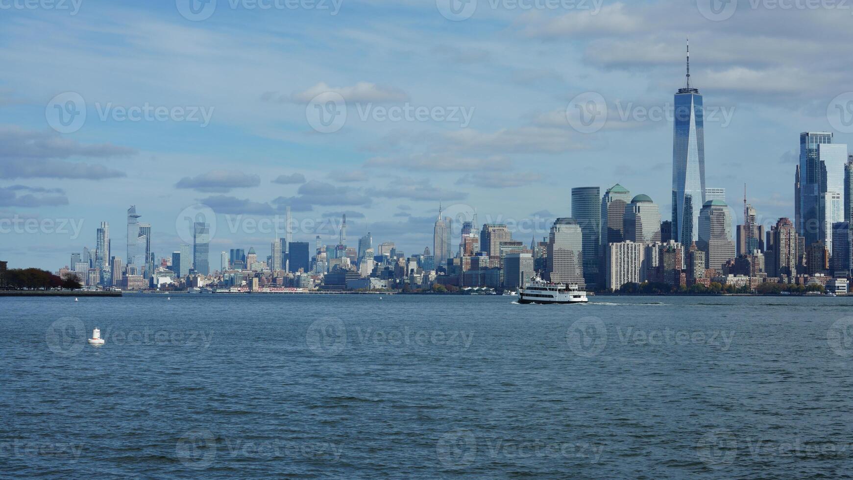 The New York manhattan view from the ferry boat in the sunny day photo