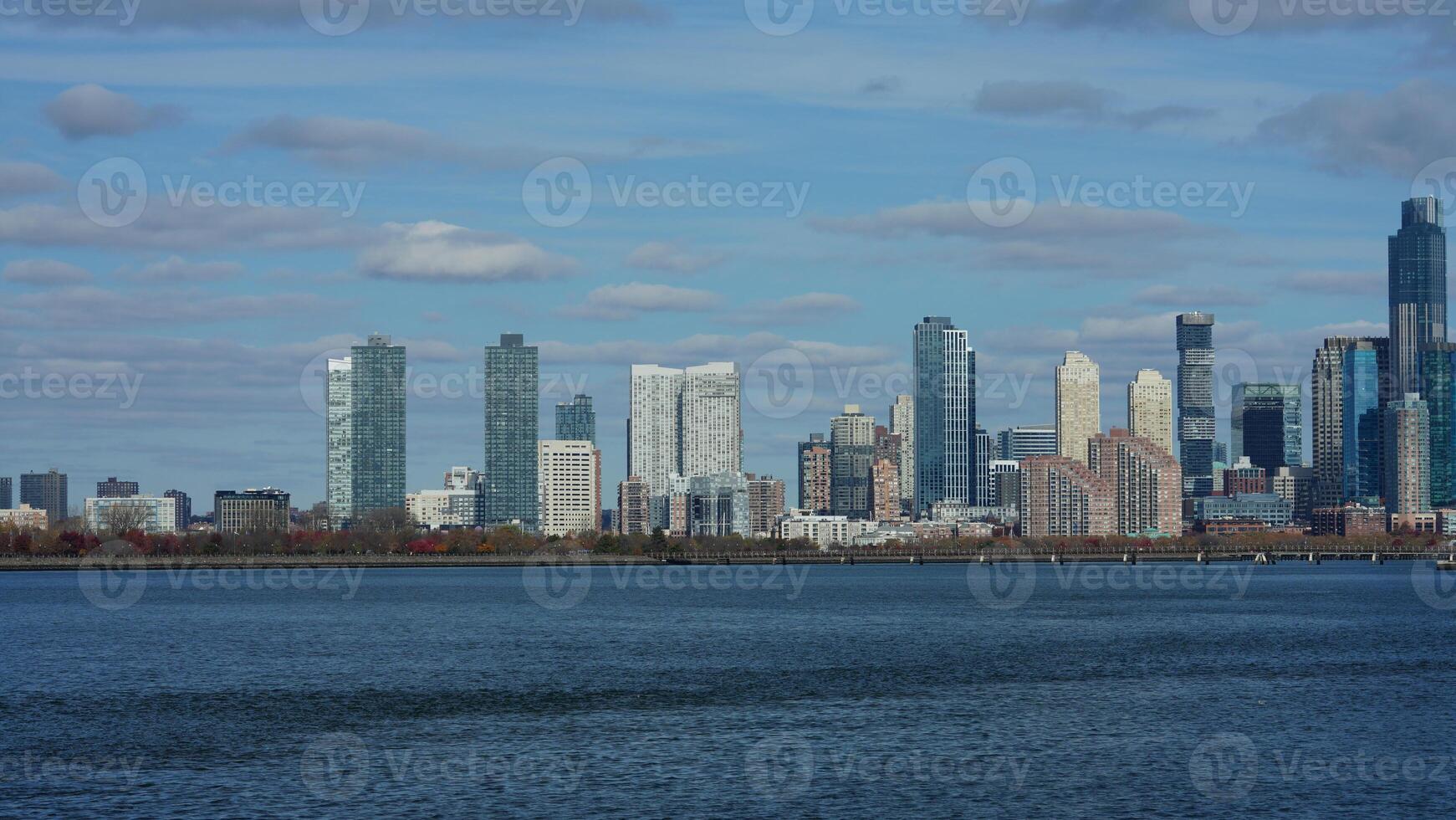 The New York manhattan view from the ferry boat in the sunny day photo