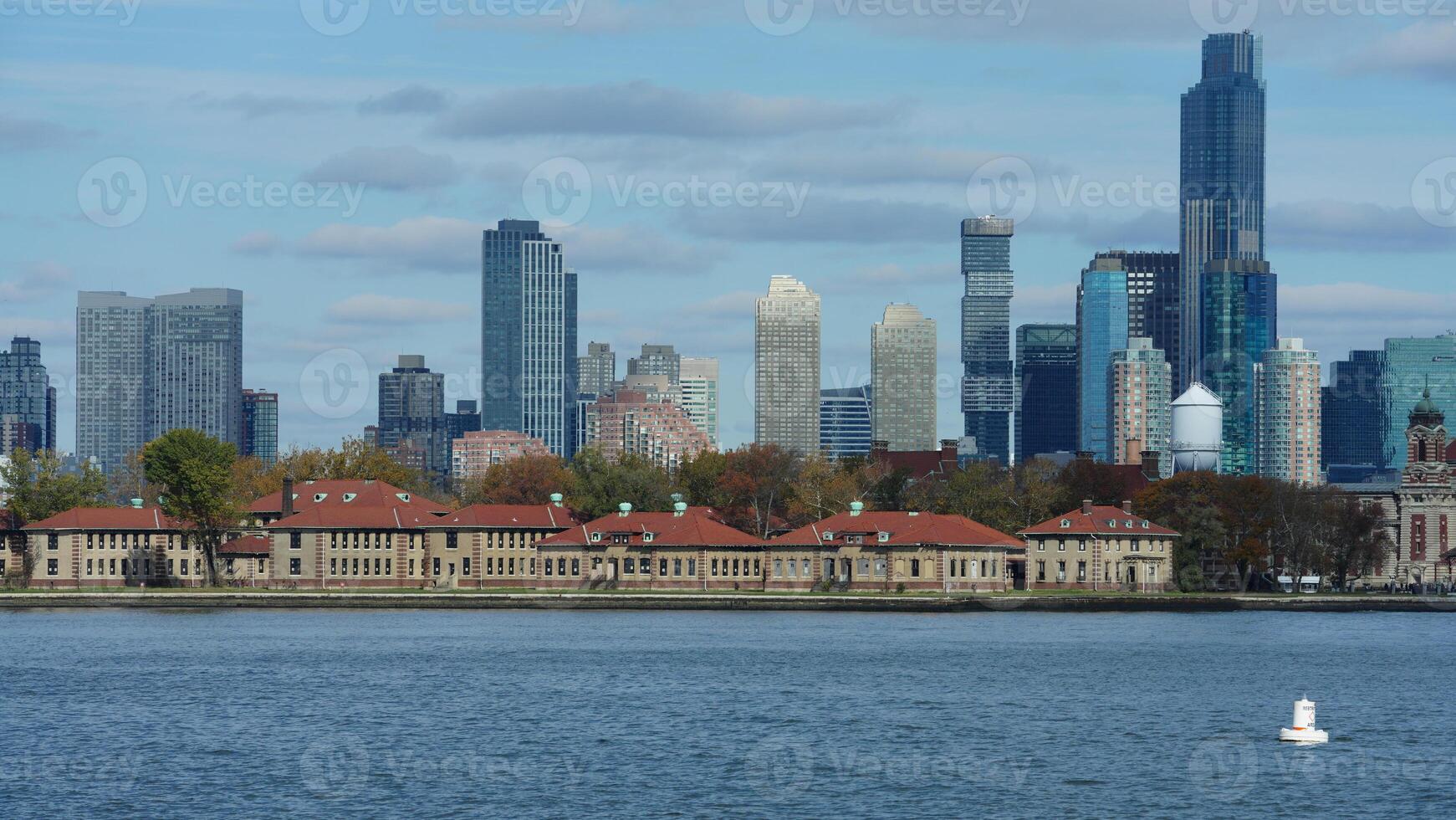 The beautiful New York city view with the colorful autumn trees and buildings as background in autumn photo