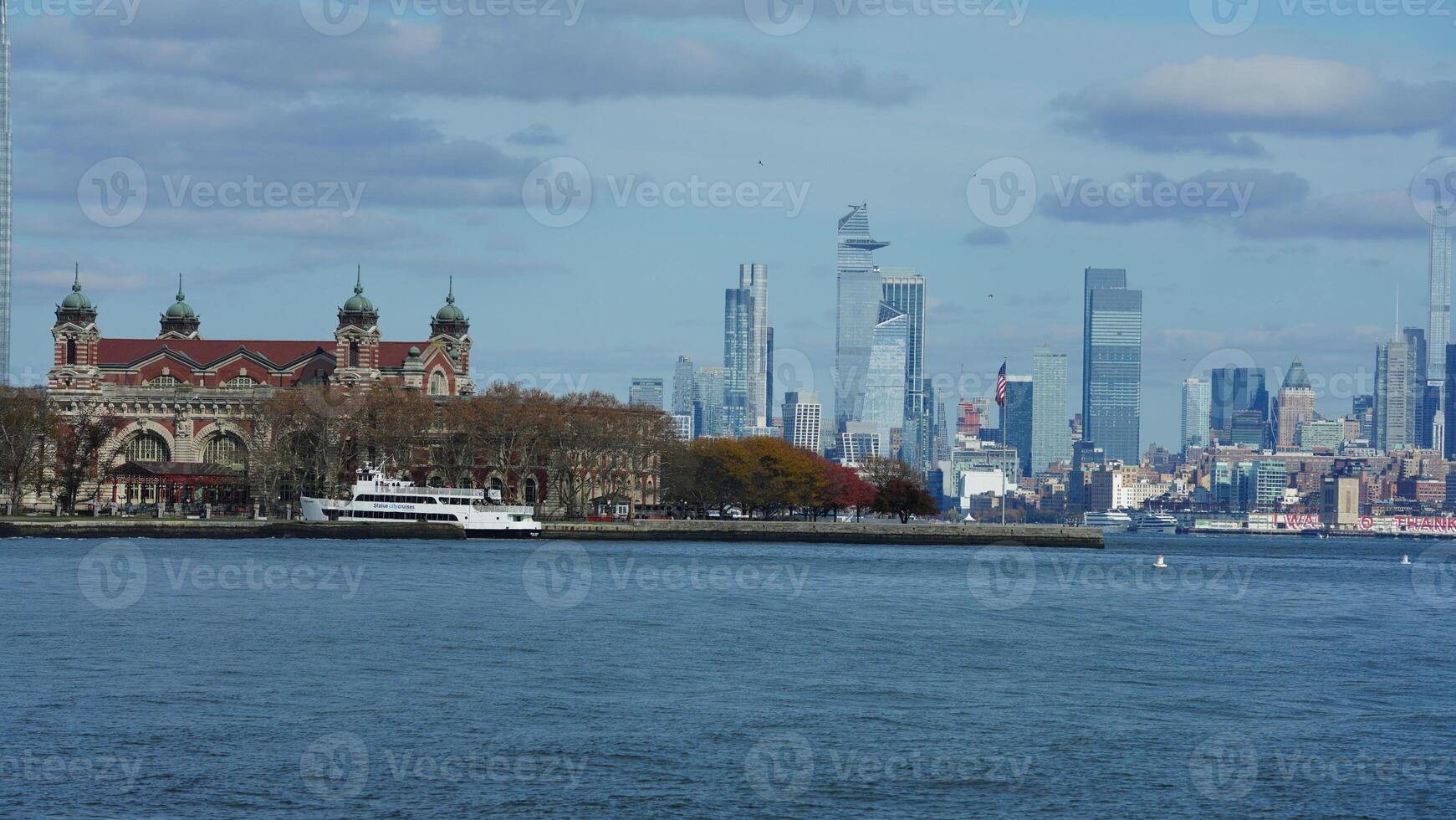 The New York manhattan view from the ferry boat in the sunny day photo