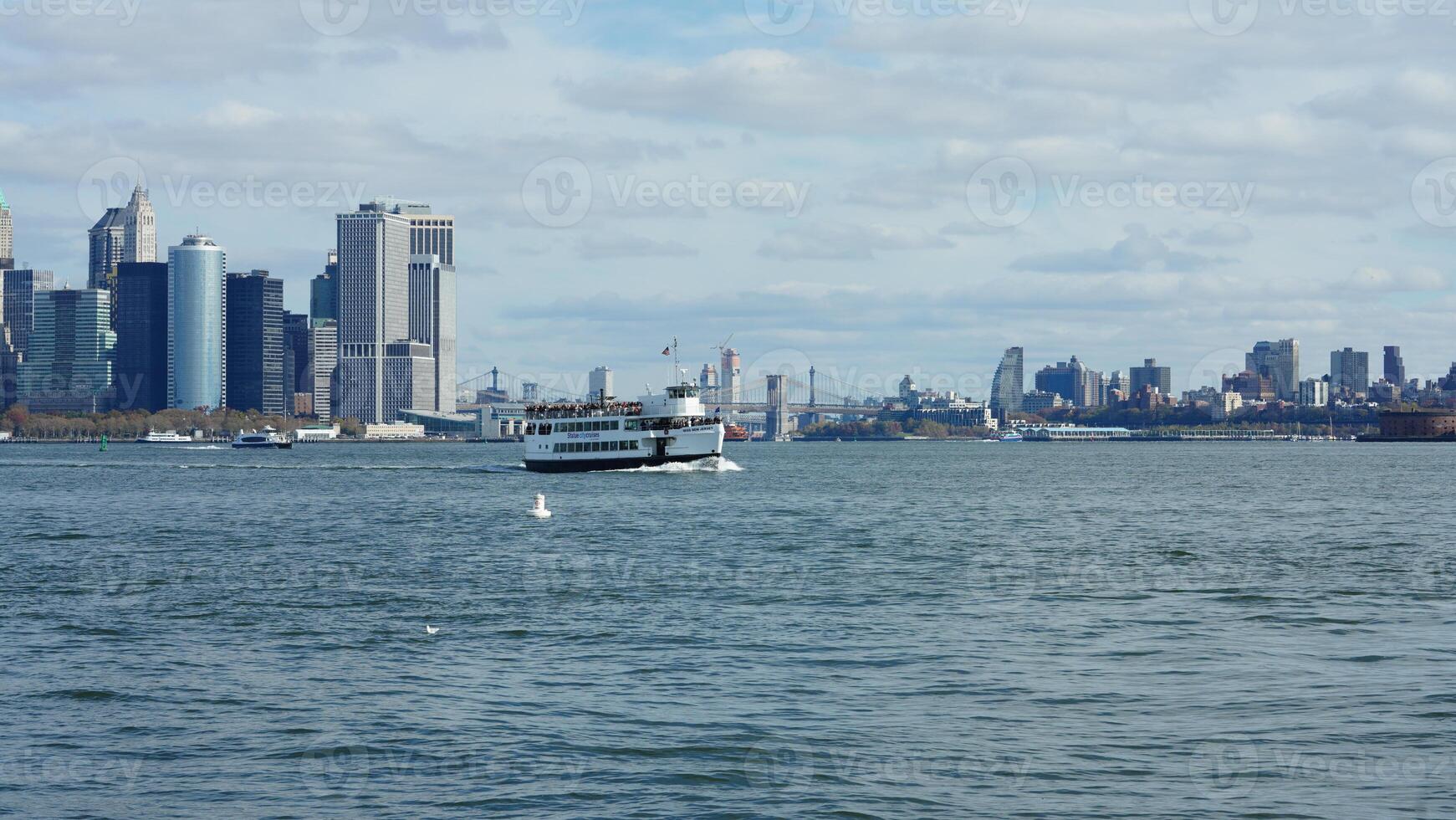 The New York manhattan view from the ferry boat in the sunny day photo