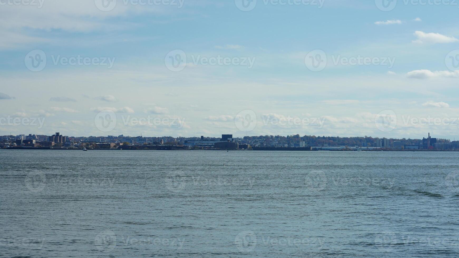 The New York manhattan view from the ferry boat in the sunny day photo