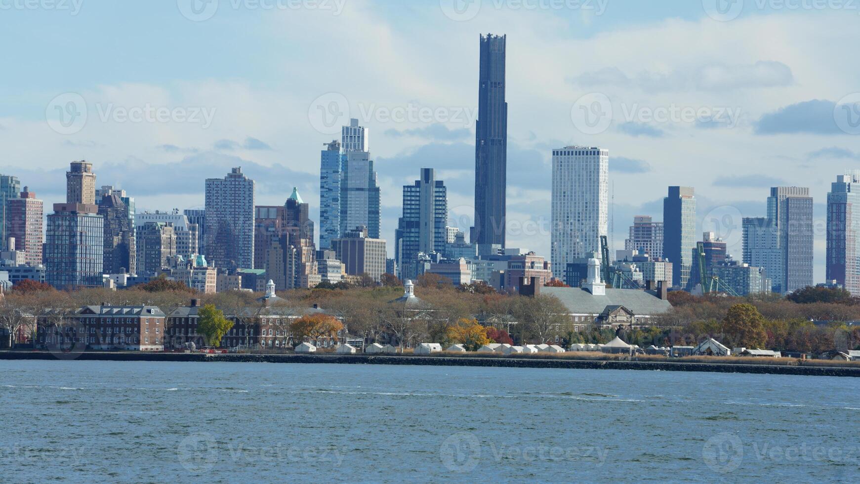 The New York manhattan view from the ferry boat in the sunny day photo