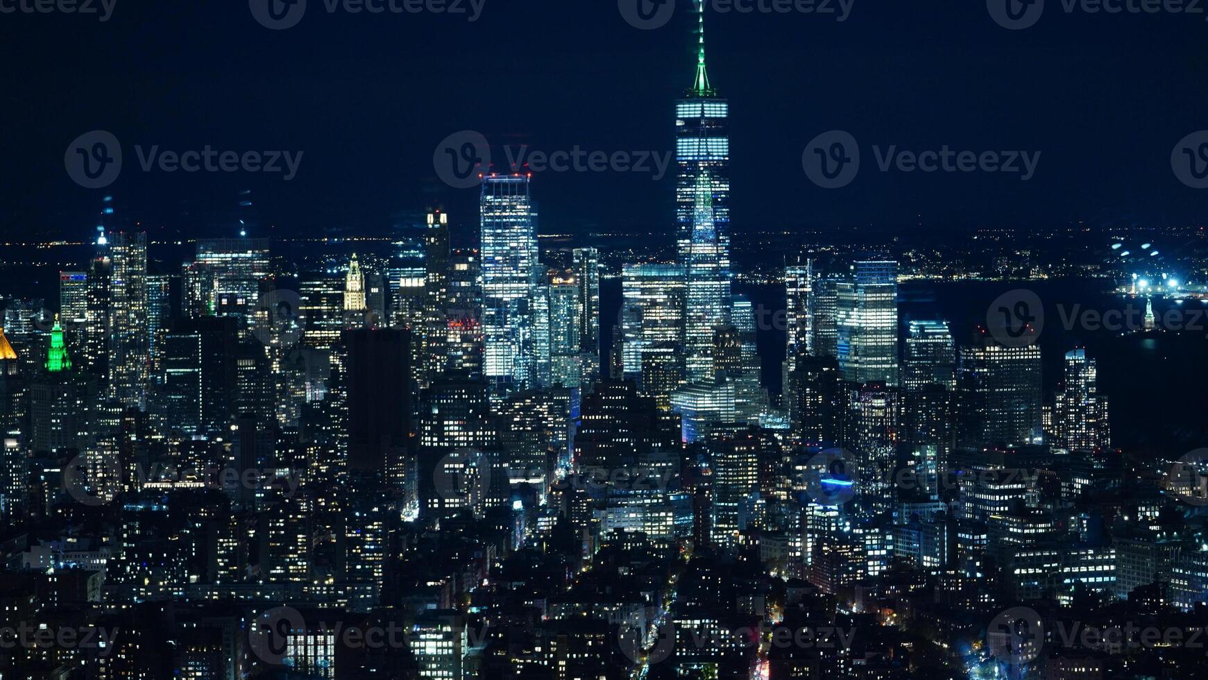 The New York city night view with the lights on in the skyscrapers at night photo