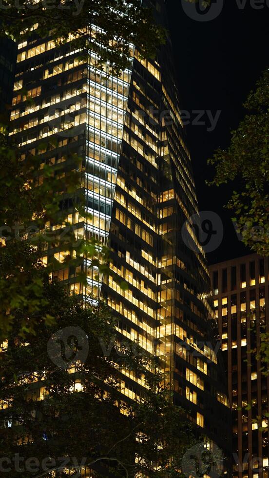 The New York city night view with the lights on in the skyscrapers at night photo