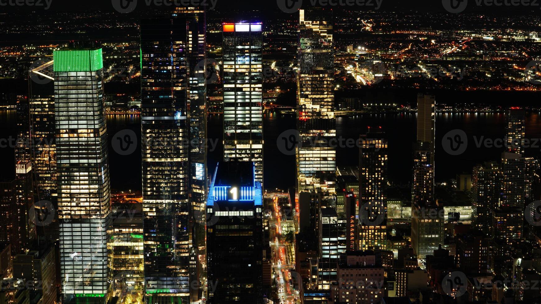 The New York city night view with the lights on in the skyscrapers at night photo