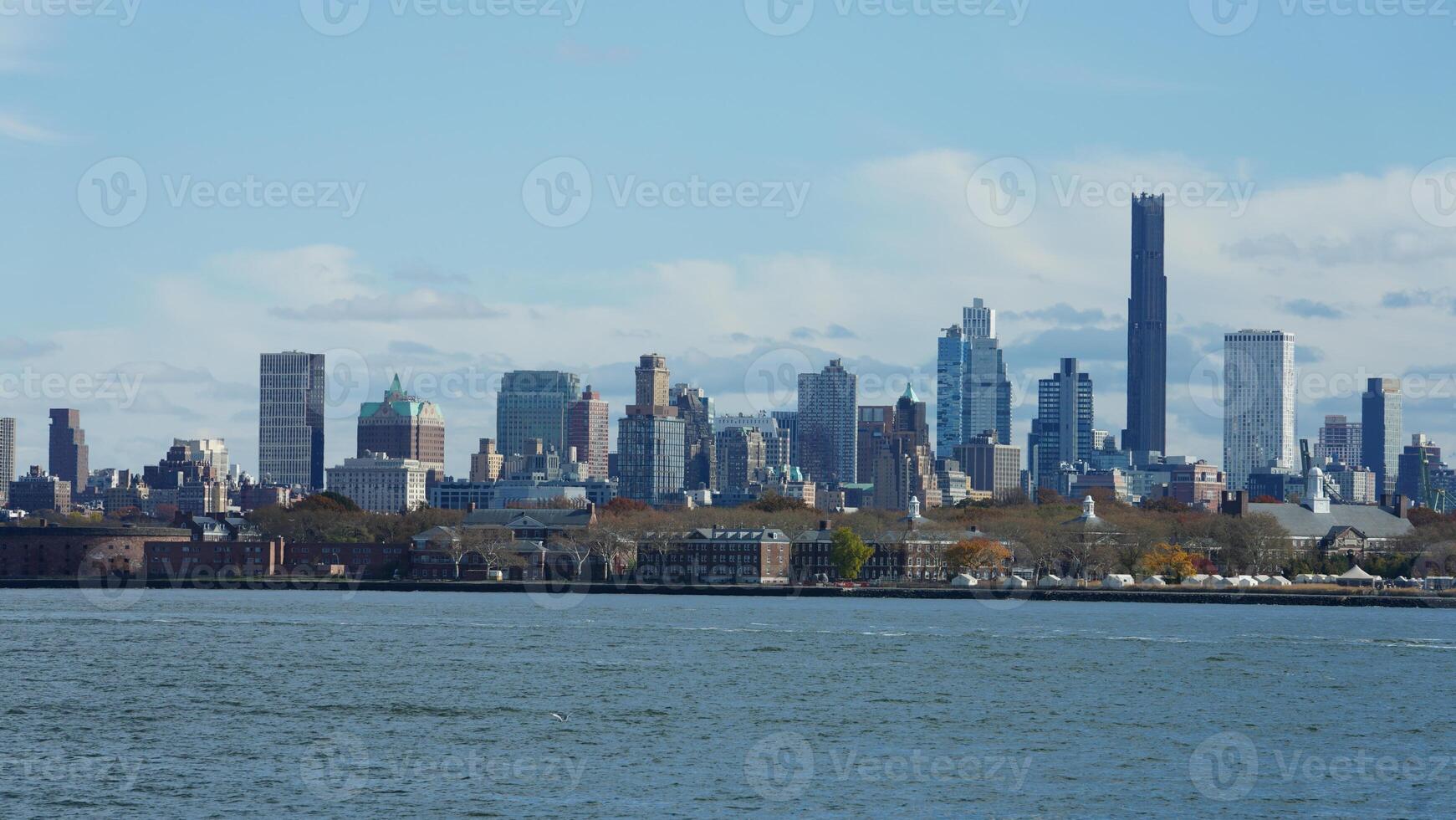 The New York manhattan view from the ferry boat in the sunny day photo
