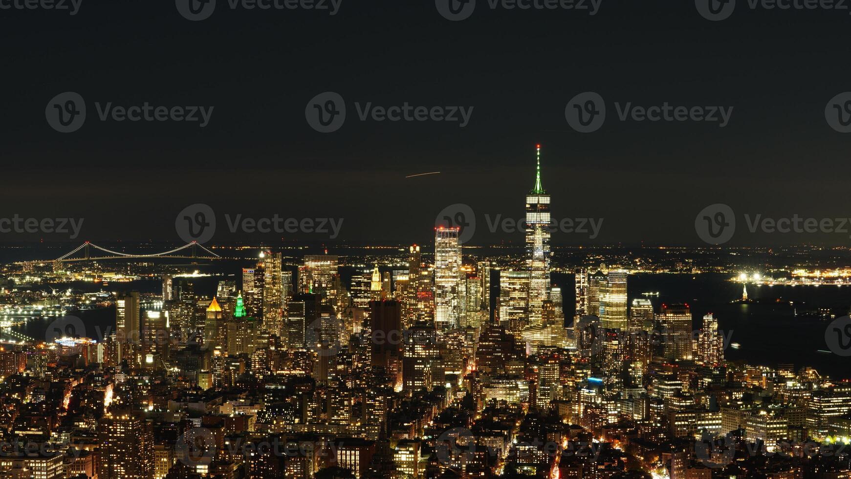 The New York city night view with the lights on in the skyscrapers at night photo