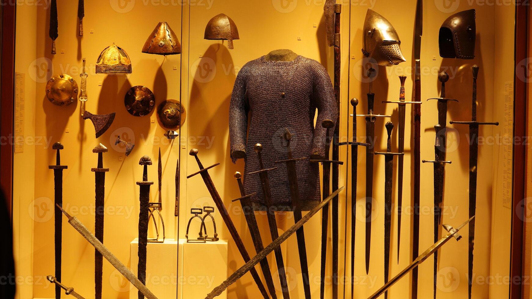 The old armors and swords exhibiting in the museum photo