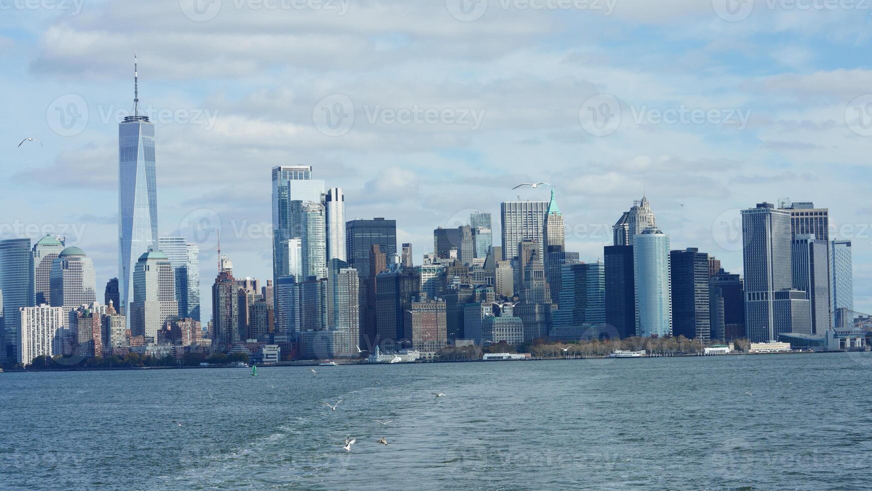 The New York manhattan view from the ferry boat in the sunny day photo