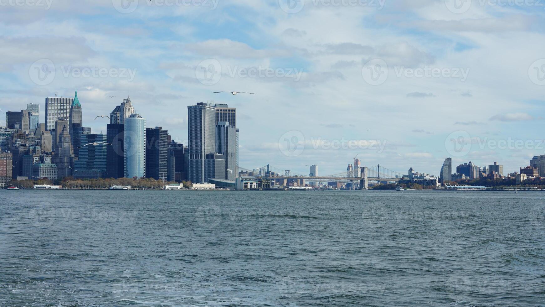 The New York manhattan view from the ferry boat in the sunny day photo