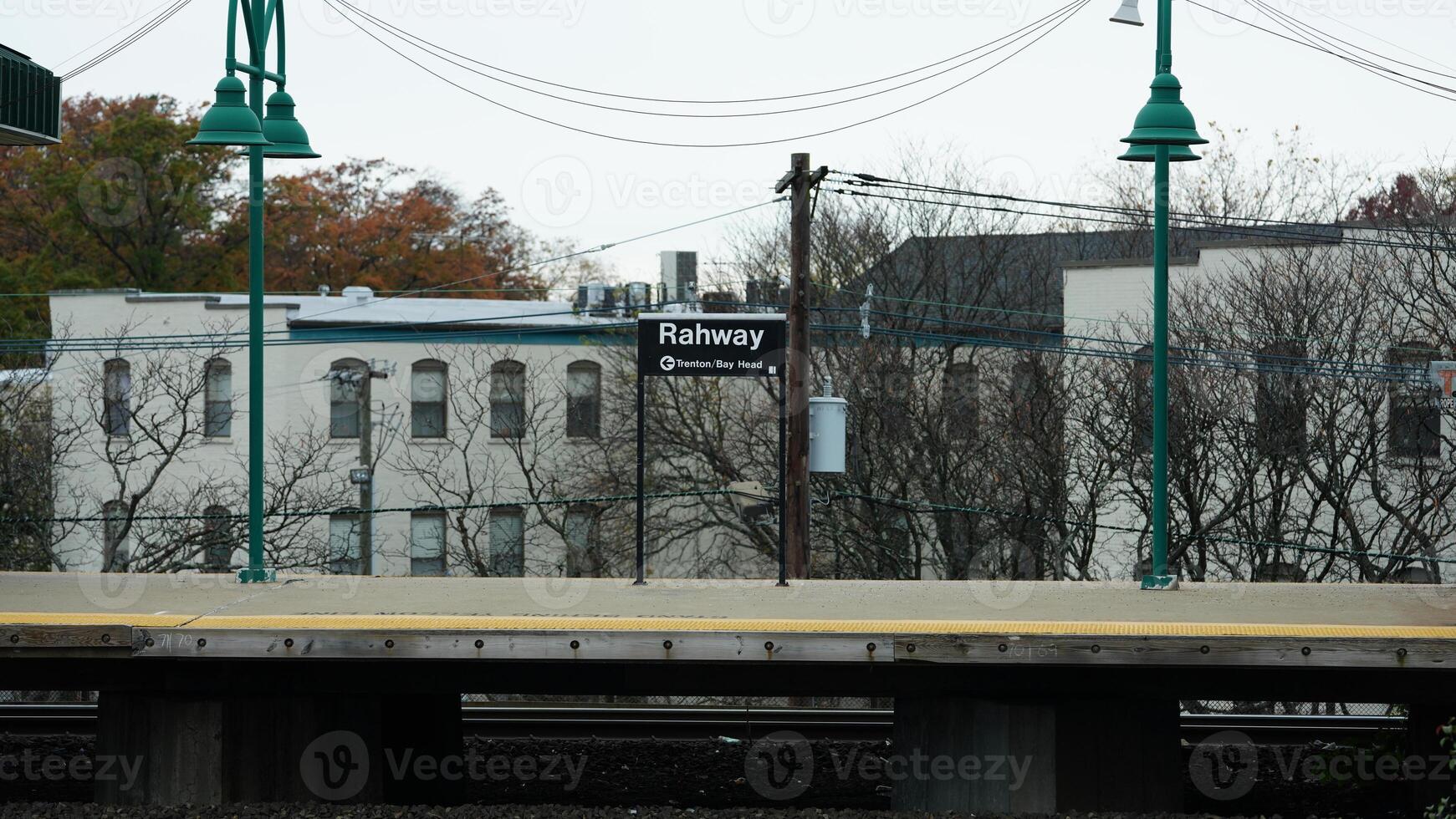 The train station view with the iron tracks near the platform photo