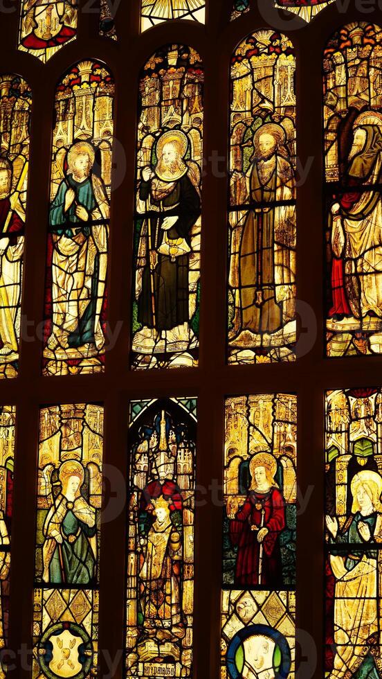 The church windows view with the religious glass drawings on them photo