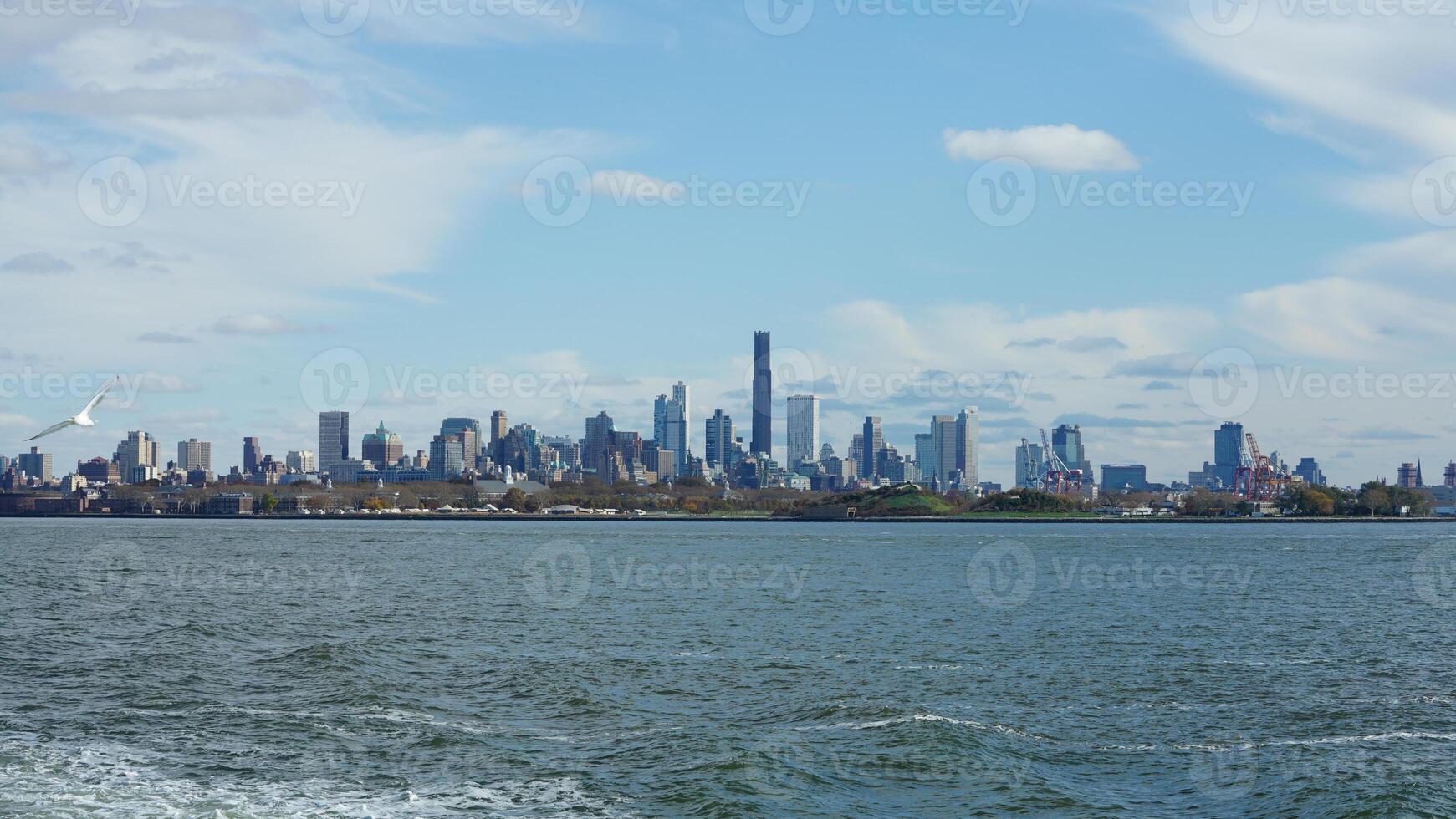 The New York manhattan view from the ferry boat in the sunny day photo