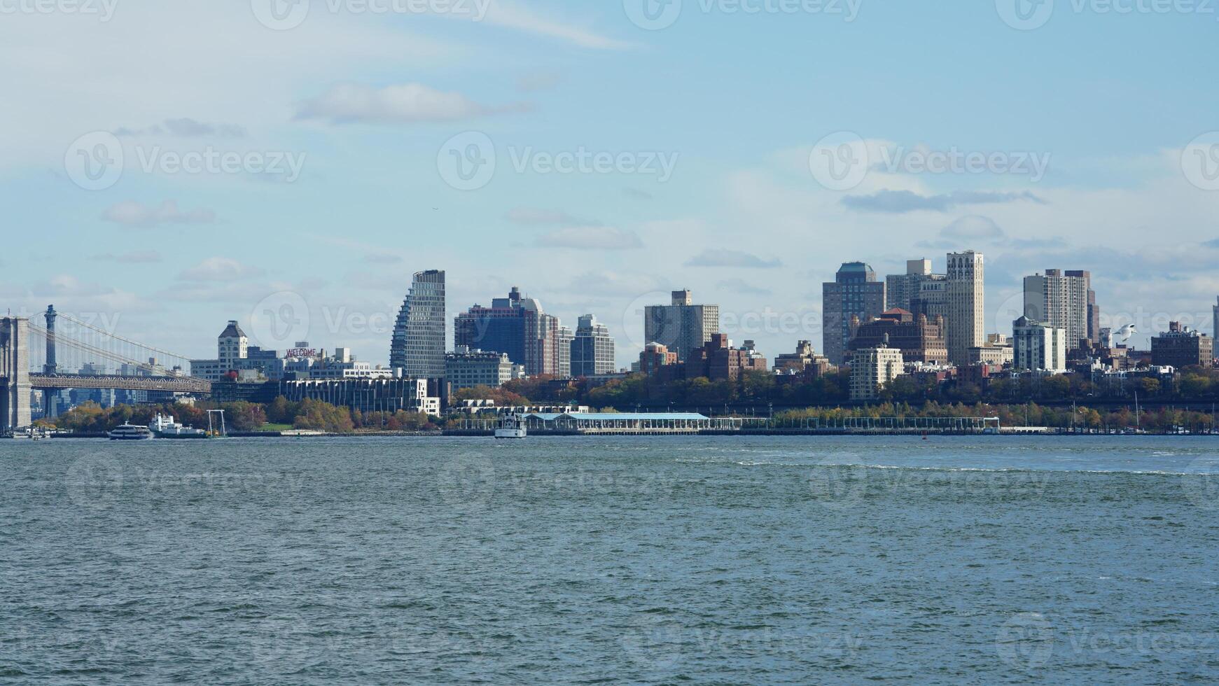 The New York manhattan view from the ferry boat in the sunny day photo