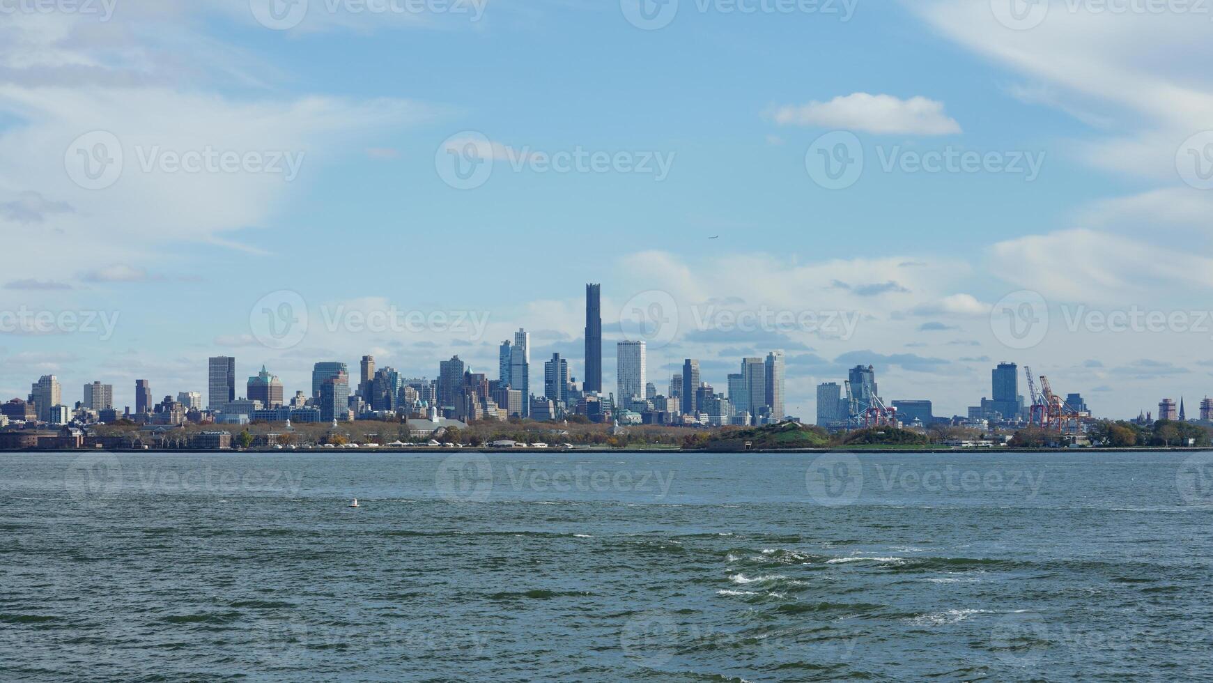 The New York manhattan view from the ferry boat in the sunny day photo