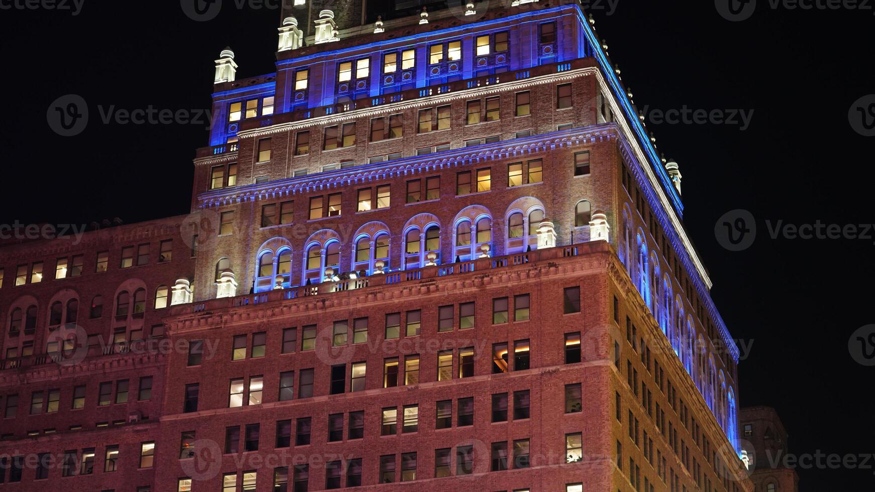 The New York city night view with the lights on in the skyscrapers at night photo