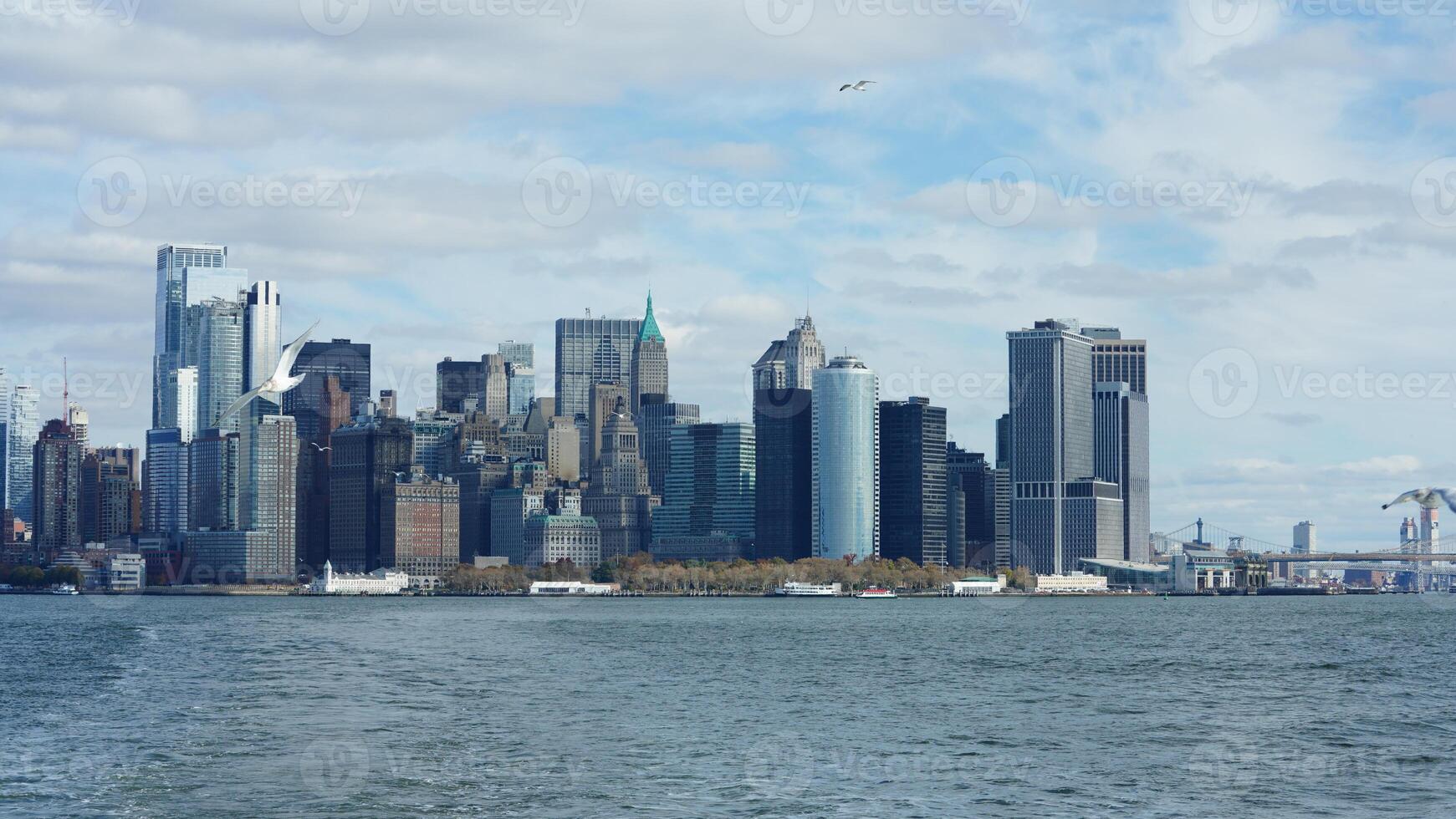 The New York manhattan view from the ferry boat in the sunny day photo