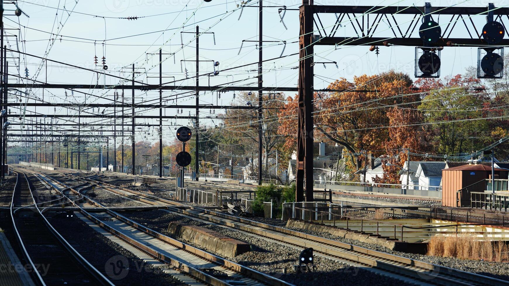 The train station view with the iron tracks near the platform photo