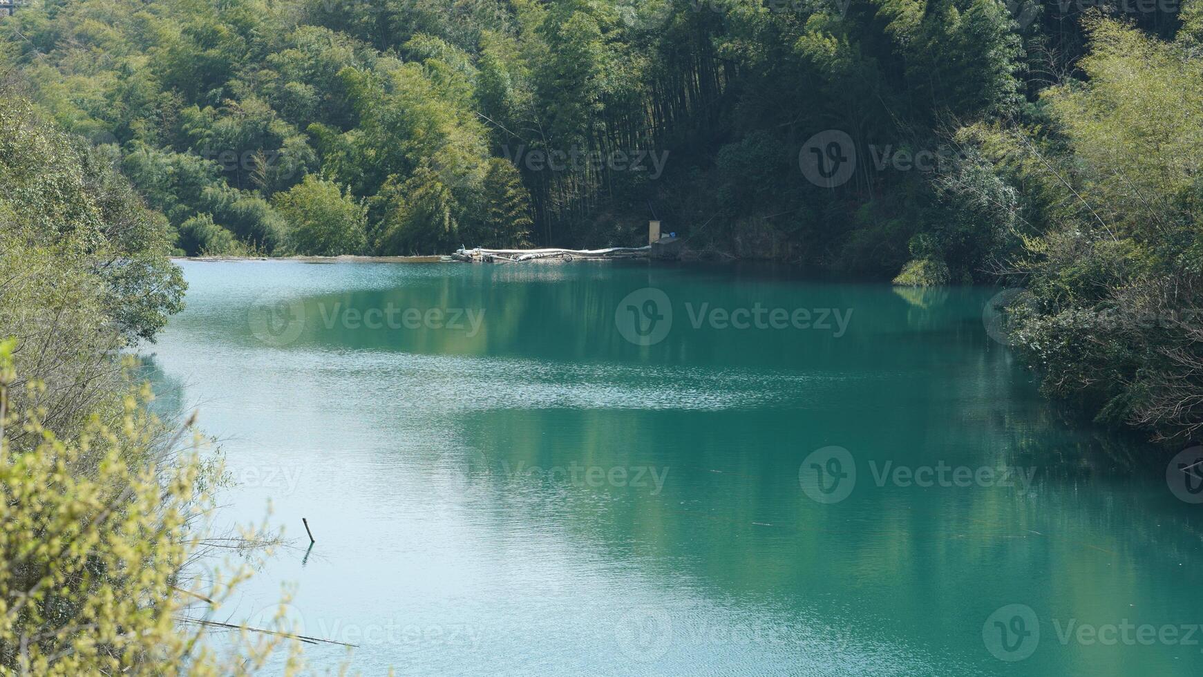 The beautiful lake landscapes with the green forest as background in the countryside of the China photo
