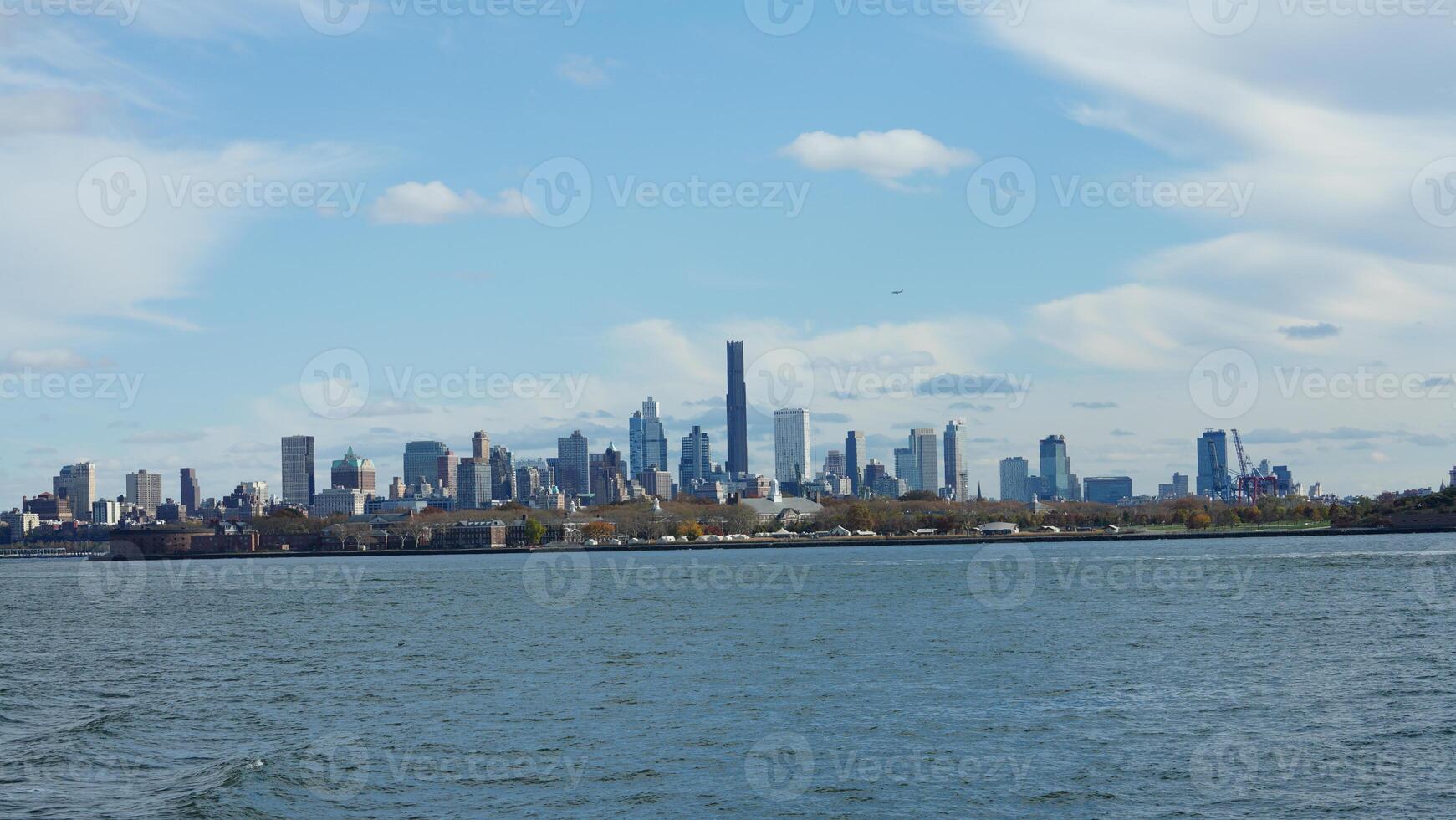 The New York manhattan view from the ferry boat in the sunny day photo