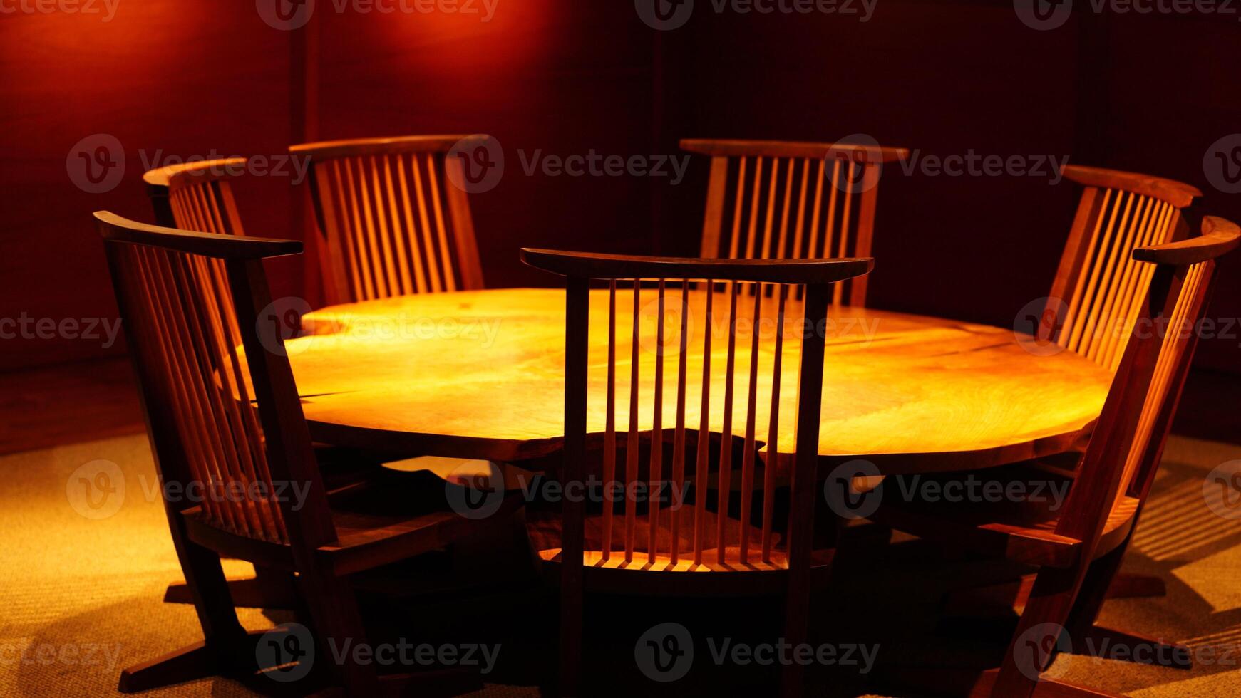 The old wooden table and chairs exhibiting in the museum photo