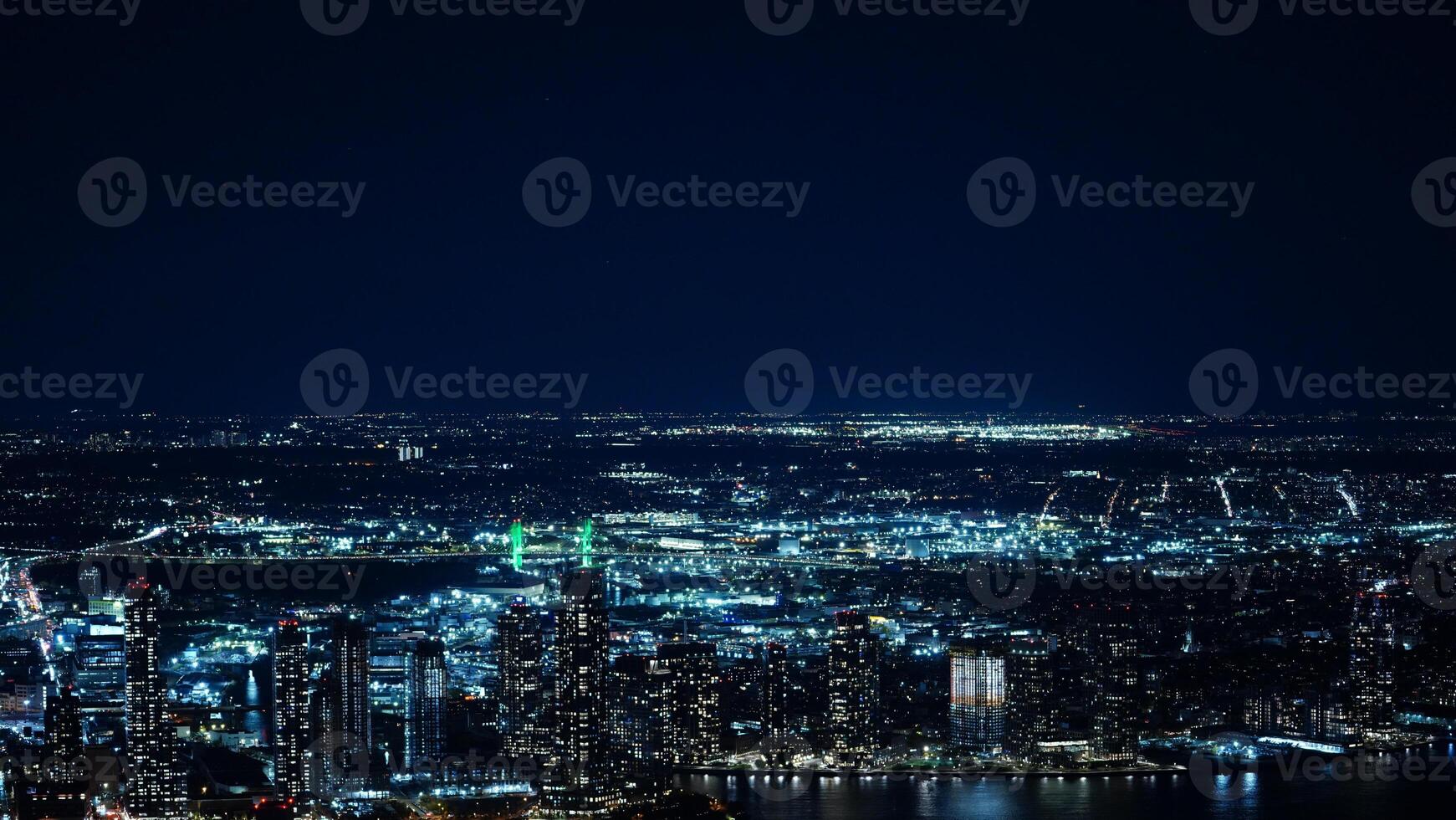 The New York city night view with the lights on in the skyscrapers at night photo