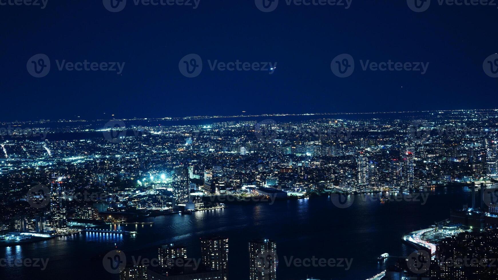 The New York city night view with the lights on in the skyscrapers at night photo