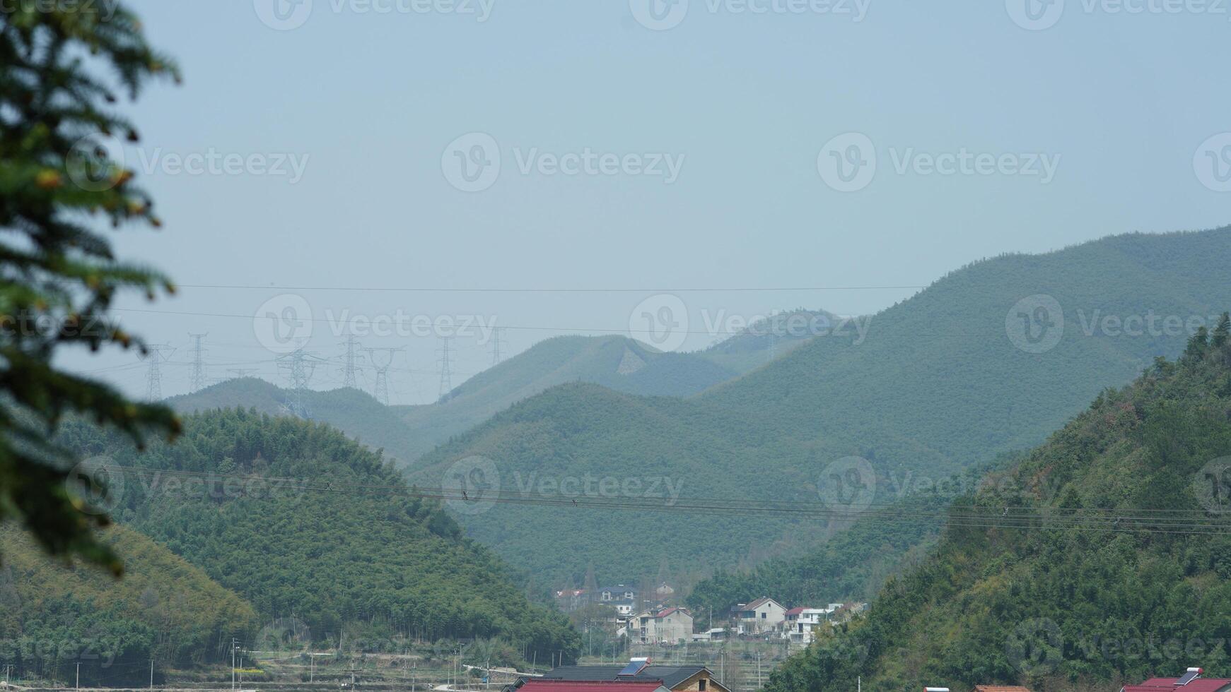 The beautiful mountains landscapes with the green bamboo forests as background in the countryside of the China photo