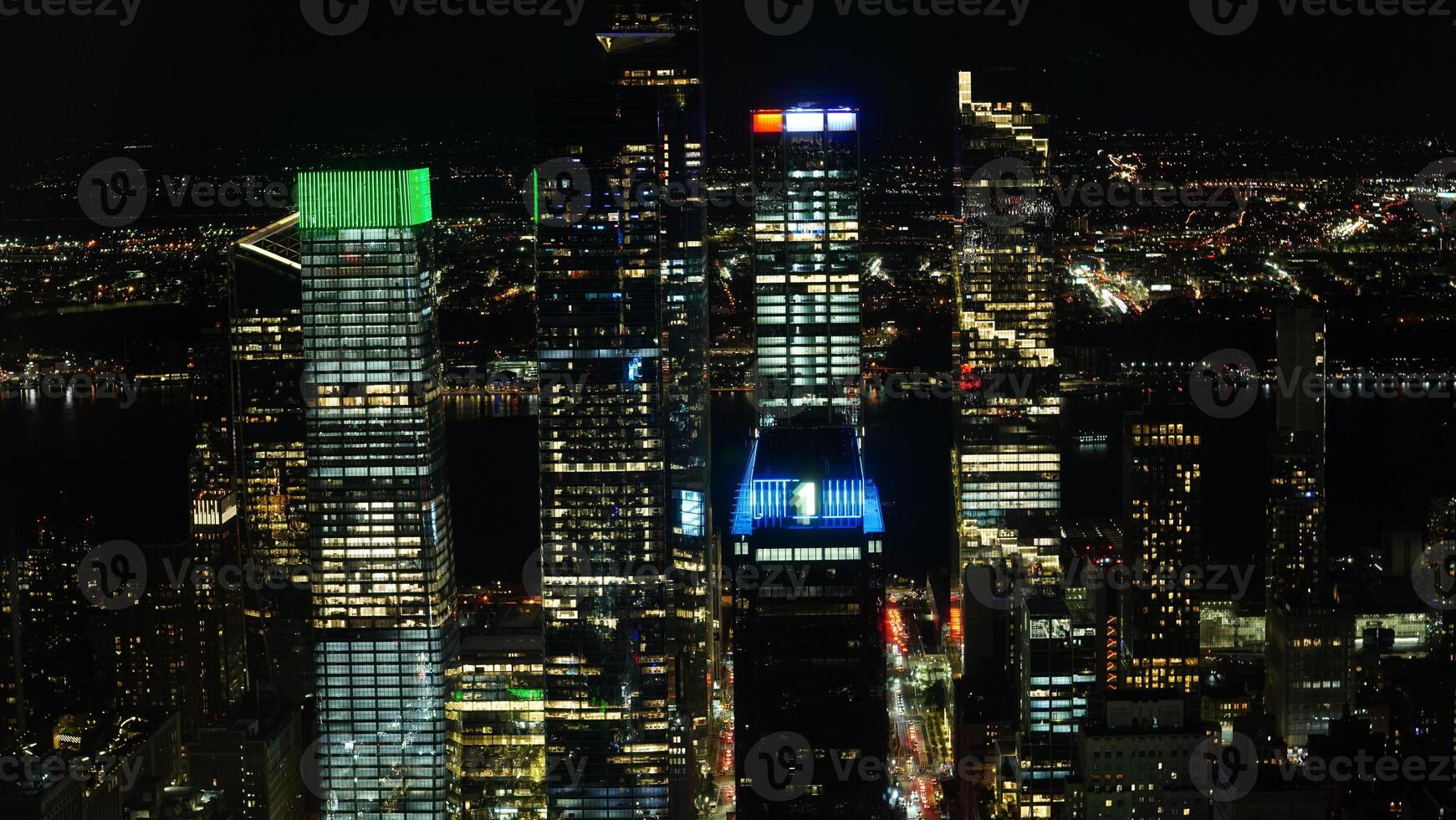 The New York city night view with the lights on in the skyscrapers at night photo