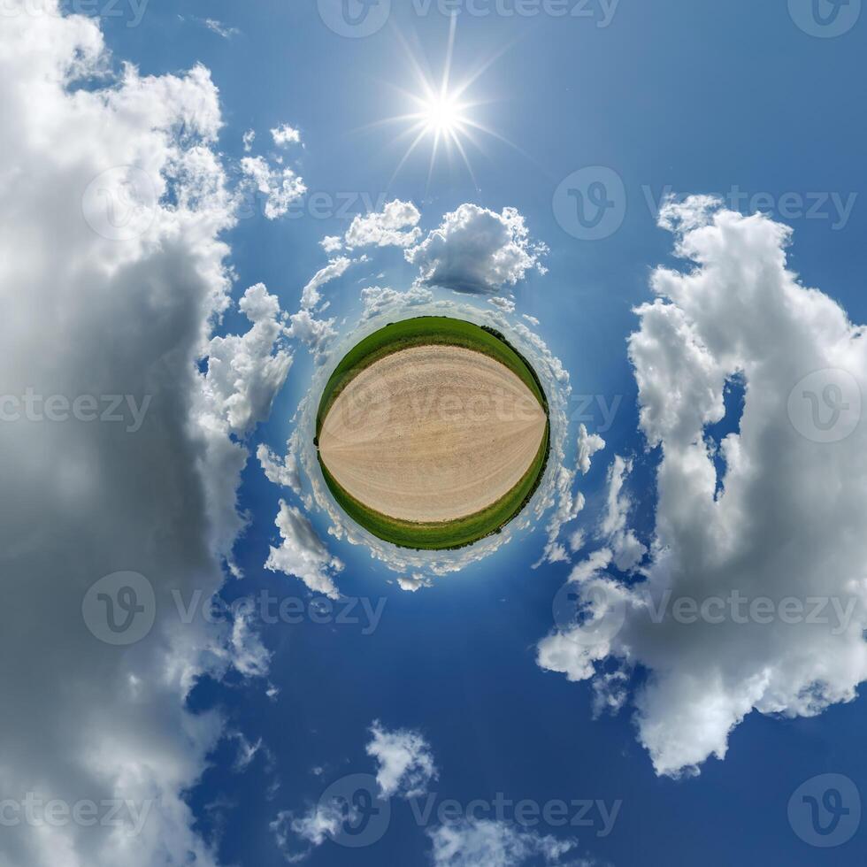 simple little tiny planet without buildings in blue sky with beautiful clouds. Transformation of spherical panorama 360 degrees. Spherical abstract aerial view. Curvature of space. photo
