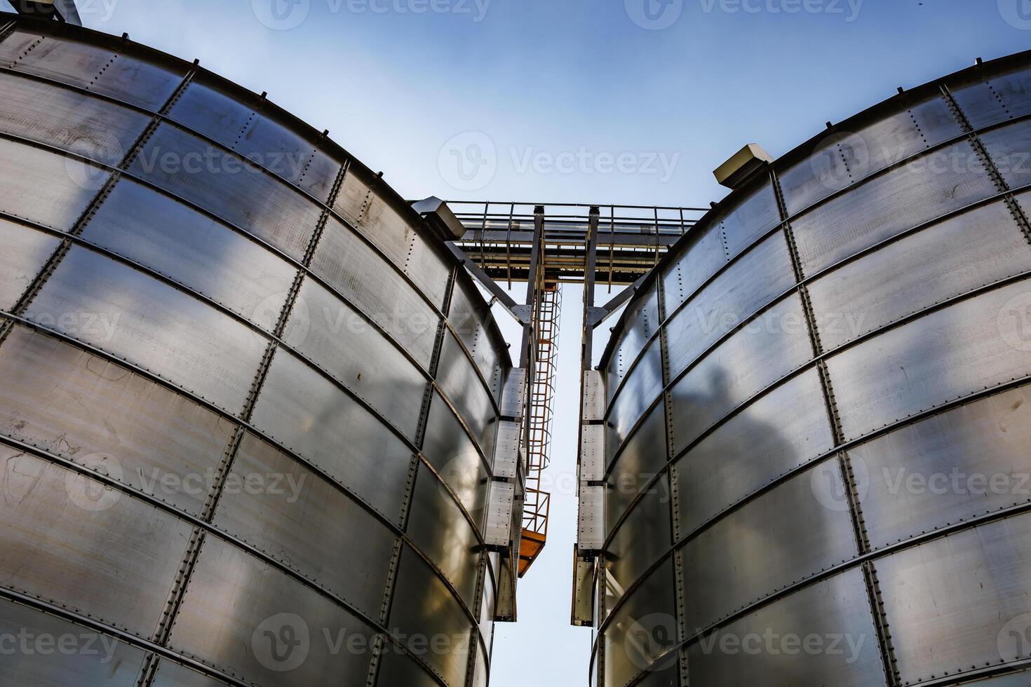 silos on agro-industrial complex with seed cleaning and drying line for grain storage. Granary elevator photo