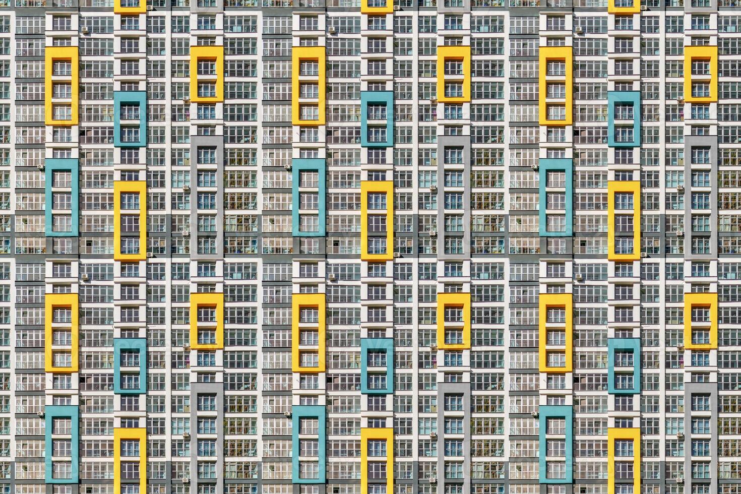 seamless frontal panoramic view on facade of modern skyscraper building with a lot of windows and balcony photo
