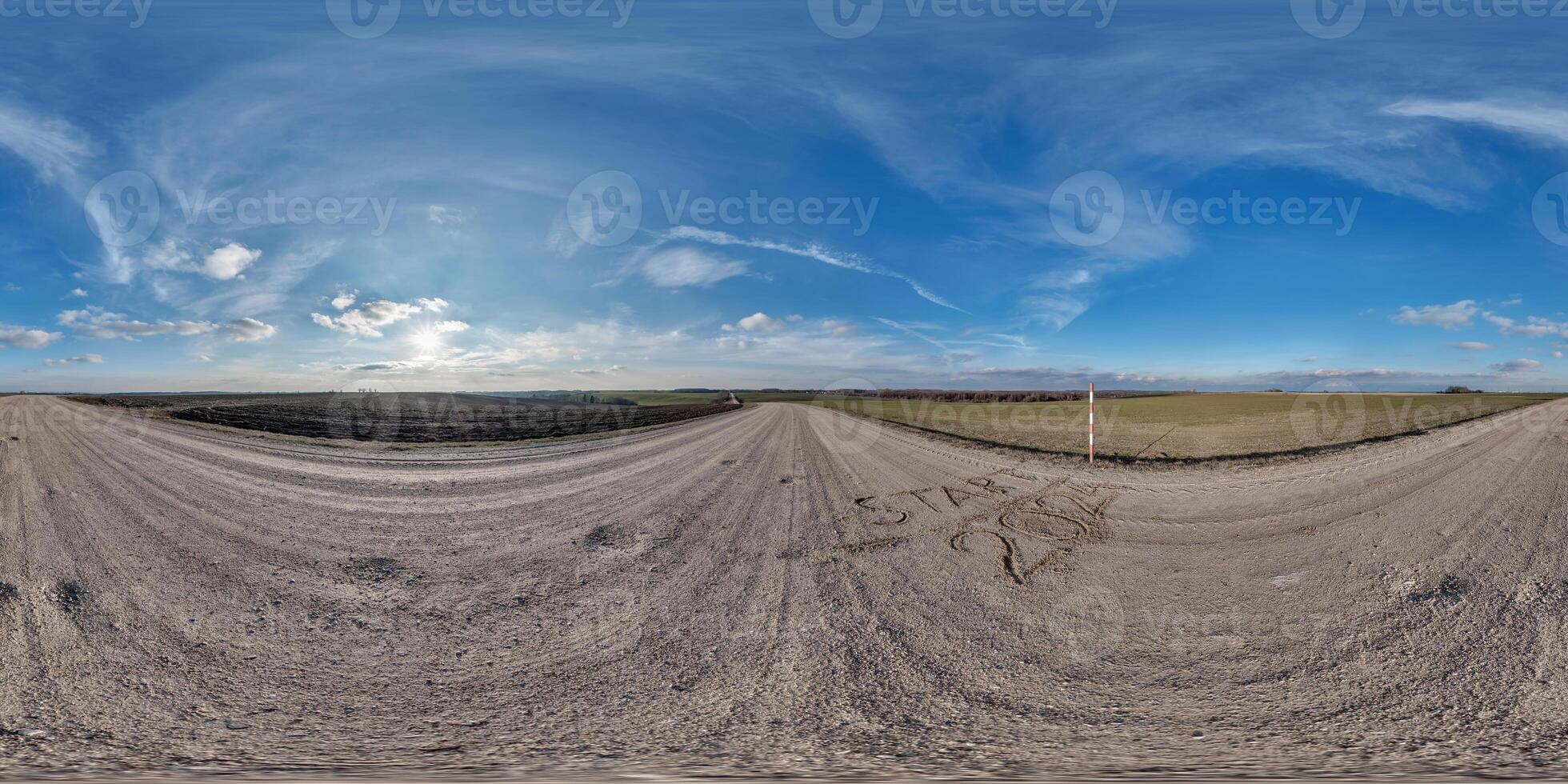 hdri 360 panorama on gravel road among fields with sign 2024 start on sand at evening with clouds in equirectangular full seamless spherical projection, for VR AR virtual reality content photo