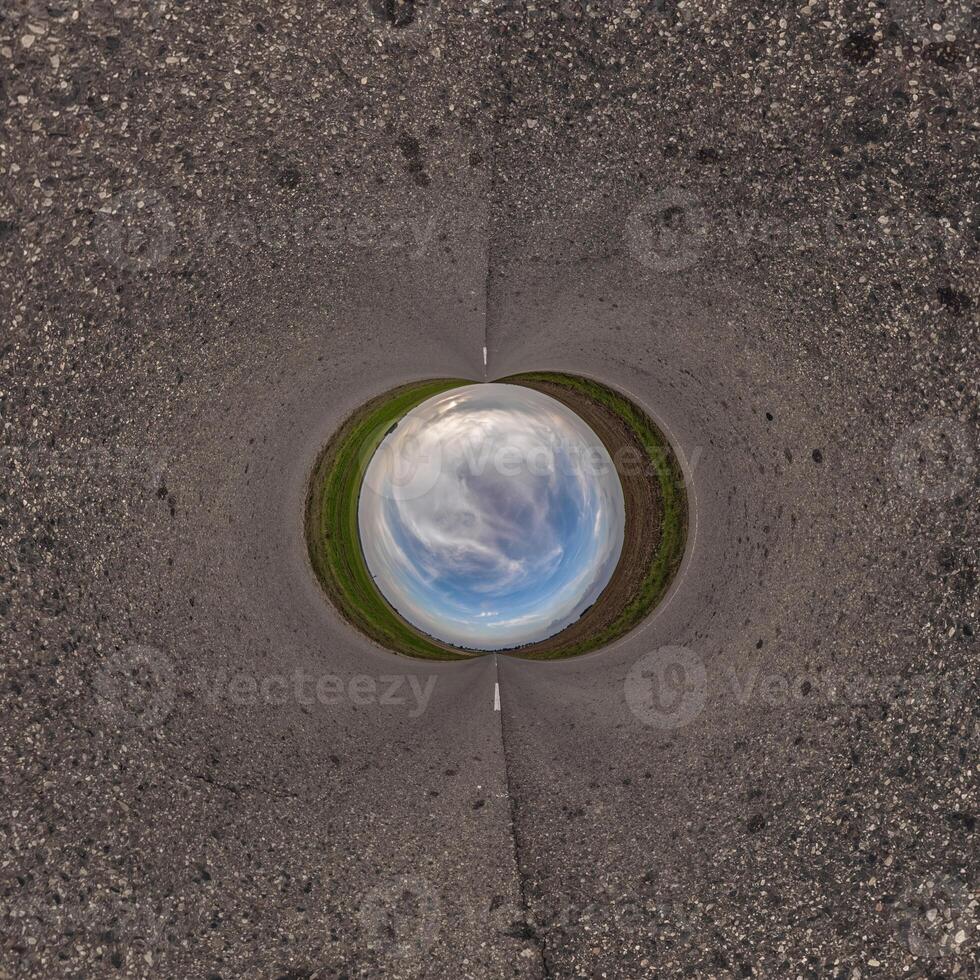 blue hole sphere or globe little planet inside sand or dry ground frame background photo