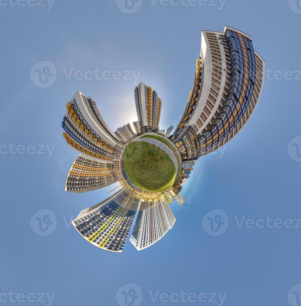 abstract swirling tiny planet spherical panorama of multi-storey buildings of skyscrapers of a residential complex in the form of a butterfly, bugs, crabs in sky with clouds photo