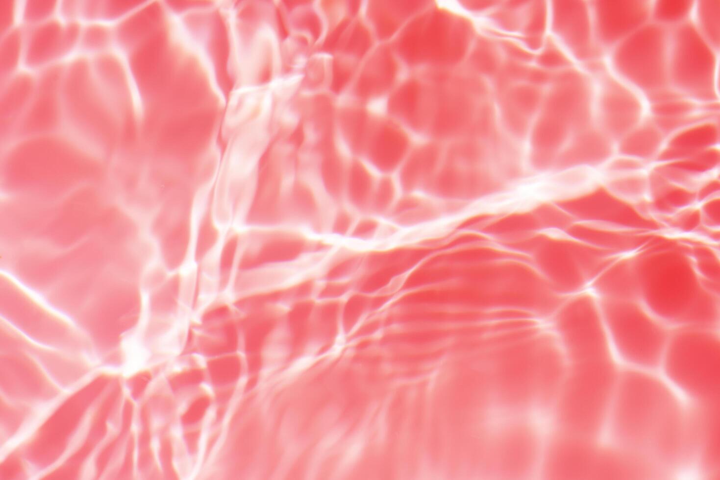 Blue water with ripples on the surface. Defocus blurred transparent blue colored clear calm water surface texture with splashes and bubbles. Water waves with shining pattern texture background. photo