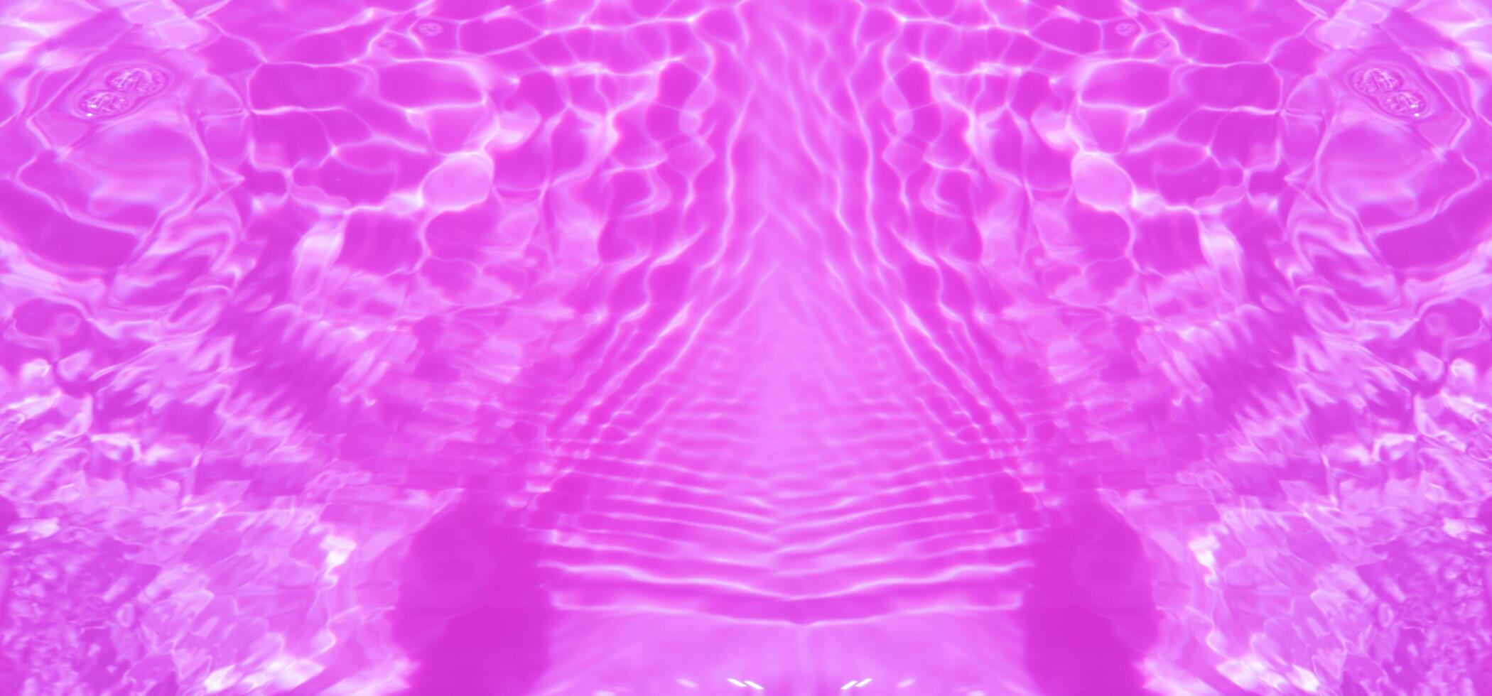 Water surface. Purple water waves on the surface ripples blurred. Transparent pink colored clear calm water surface texture with splash and bubbles. Purple water waves with shining patterns. Caustics. photo