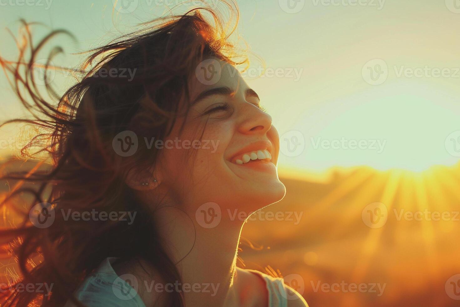 Happy woman enjoying the moment, smiling face, wind is in the hair, sun shining on the face. Bucket lifestyle concept. photo